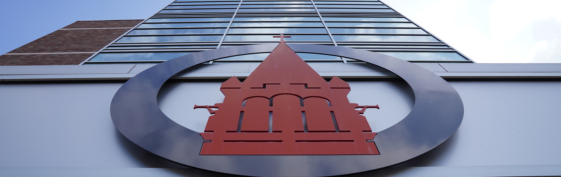 UIW seal on exterior of building