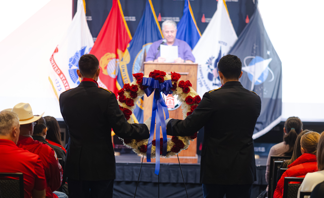 ROTC cadets carrying wreath