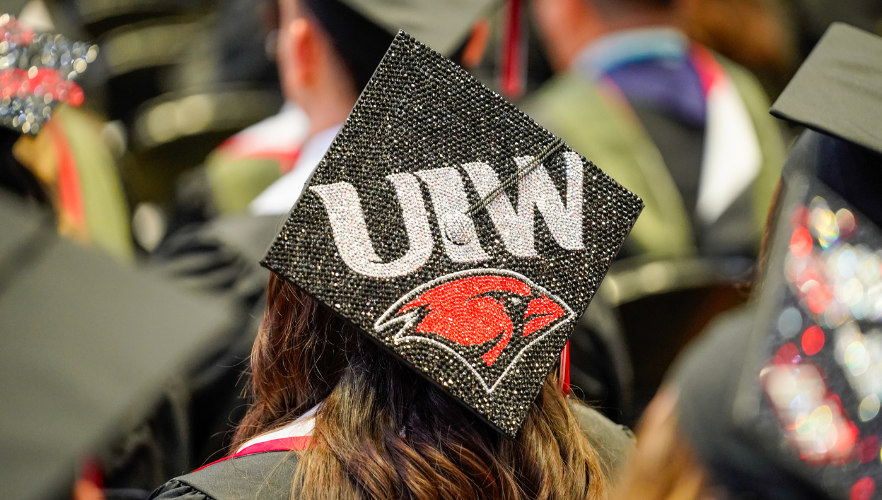 Graduate cap with UIW Cardinal logo