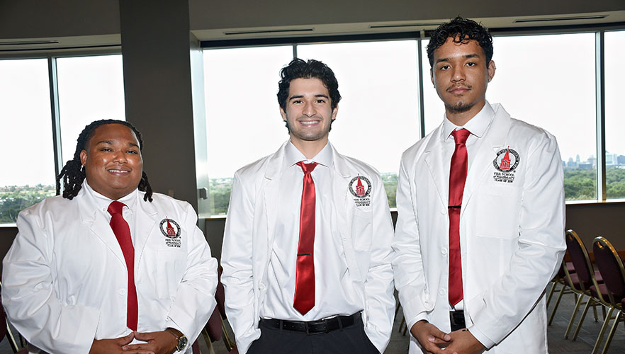Students wearing white coats