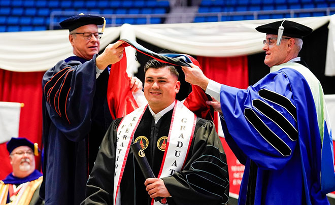 Carlos Angel Reyes crossing the stage