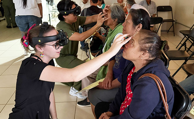 vision student checking patient